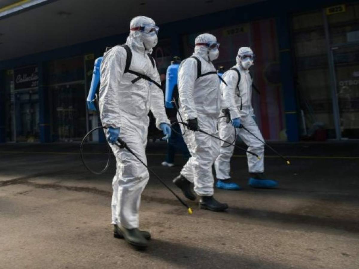 Members of Sofia's Municipality disinfects the biggest market for Chinese goods in Sofia to prevent the spread of the COVID-19, the novel coronavirus, on March 12, 2020. (Photo by NIKOLAY DOYCHINOV / AFP)