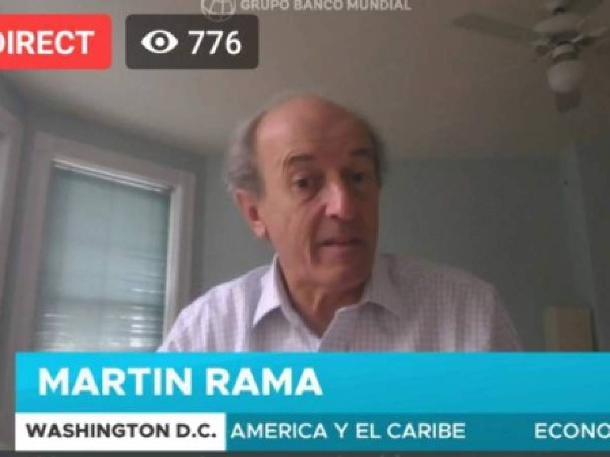 In this screen picture taken on April 12, 2020, during a video press conference, Martin Rama, the World Bank's chief economist for Latin America and the Caribbean, is seen in his home in Washington, DC, as he explains the magnitude of the crisis caused by the COVID-19. (Photo by Ariela NAVARRO / AFP)