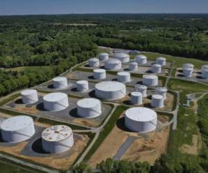 (FILES) In this file photo taken on May 13, 2021, in an aerial view, fuel holding tanks are seen at Colonial Pipeline's Dorsey Junction Station in Woodbine, Maryland. (Photo by Drew Angerer / GETTY IMAGES NORTH AMERICA / AFP)
