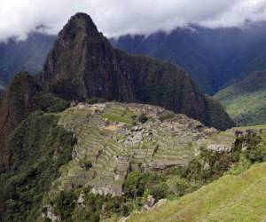 (FILES) File photo taken on December 30, 2014, of the Machu Picchu complex, the Inca fortress enclaved in the south eastern Andes of Peru, near Cuzco. - Peruvian President Martin Vizcarra on January 9, 2020, launched a campaign to reforest the Machu Picchu archaeological sanctuary with a million trees, in order to protect the Inca citadel against rain and landslides. (Photo by Cris BOURONCLE / AFP)