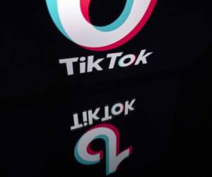 (FILES) This illustration photo taken on November 21, 2019, shows the logo of the social media video sharing app Tiktok displayed on a tablet screen in Paris. - TikTok pushed back on July 29, 2020 at what it called 'maligning attacks' by Facebook as the fast-growing video-sharing app claimed it helps competition in the US market. The comments by TikTok came hours ahead of a hotly anticipated antitrust hearing with the top executives of Facebook and three other Big Tech firms, and amid suggestions the app may be banned due to its connections to China. (Photo by Lionel BONAVENTURE / AFP)