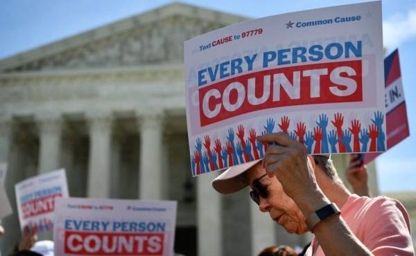 (FILES) In this file photo demonstrators rally at the US Supreme Court in Washington, DC, on April 23, 2019, to protest a proposal to add a citizenship question in the 2020 Census. - US President Donald Trump's administration wages its last major policy fight before the Supreme Court on November 30, 2020 as it seeks to exclude undocumented immigrants from the population count used to determine states' representation in Congress. If the outgoing president's plan goes forward, states with large numbers of undocumented immigrants could see their influence reduced in the US House of Representatives. (Photo by MANDEL NGAN / AFP)