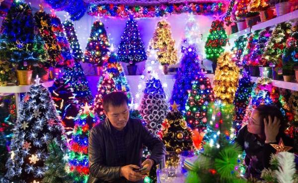 November 27, 2015, Yiwu China - A stall featuring Christmas trees in the Festival Arts section of Arts of Crafts inside the Yiwu International Trade Market. Yiwu International Trade Market is the world's largest whole sale market for small commodities. These plastic trees are made locally at the Sinte An factory.