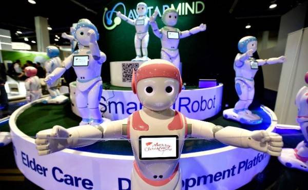 LAS VEGAS, NV - JANUARY 10: A chorus of iPal robots sing for attendees at the AvatarMind booth during CES 2018 at the Las Vegas Convention Center on January 10, 2018 in Las Vegas, Nevada. CES, the world's largest annual consumer technology trade show, runs through January 12 and features about 3,900 exhibitors showing off their latest products and services to more than 170,000 attendees. David Becker/Getty Images/AFP