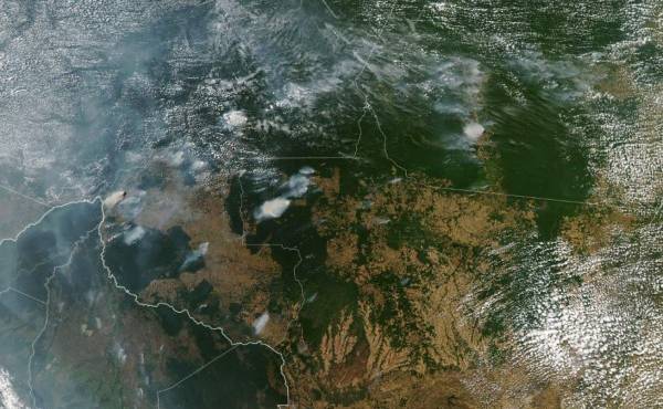 This handout picture collected by a satellite of © 2019 Planet Labs, Inc on August 20, 2019 shows smoke and fires in Brazil's state Mato Grosso. - This week saw an outpouring of social media posts decrying forest fires in the Amazon rainforest, many of them under the hashtag #PrayforAmazonas. But some of the most viral posts are misleading, including either photographs of the Amazon that are years old or images taken in other parts of the world. (Photo by Handout / © 2019 Planet Labs, Inc / AFP) / RESTRICTED TO EDITORIAL USE - MANDATORY CREDIT 'AFP PHOTO / © 2019 Planet Labs, Inc ' - NO MARKETING - NO ADVERTISING CAMPAIGNS - DISTRIBUTED AS A SERVICE TO CLIENTS