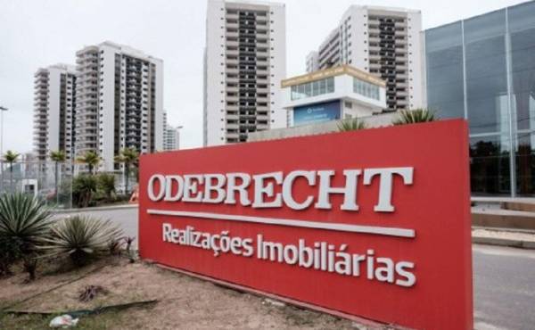 (FILES) This file photo taken on June 23, 2016 shows a logo of Brazilian construction company Odebrecht at the Olympic and Paralympic Village in Rio de Janeiro, Brazil.Brazil-based construction giant Odebrecht on December 21, 2016 agreed to pay fines of at least $2.6 billion to US, Brazilian and Swiss authorities, in what the US is calling the largest foreign bribery case in history. The US Justice Department said the conglomerate pled guilty to paying hundreds of millions to bribe government officials in countries on three continents. / AFP PHOTO / YASUYOSHI CHIBA