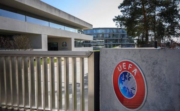 A picture taken in Nyon on March 17, 2020 shows the gate at the headquarters of UEFA, the European football's governing body, amid spread of novel coronavirus (COVID-19). - UEFA has proposed postponing the European Championship, due to take place across the continent in June and July this year, until 2021 at crisis meetings on Tuesday, a source close to European football's governing body told AFP. (Photo by FABRICE COFFRINI / AFP)