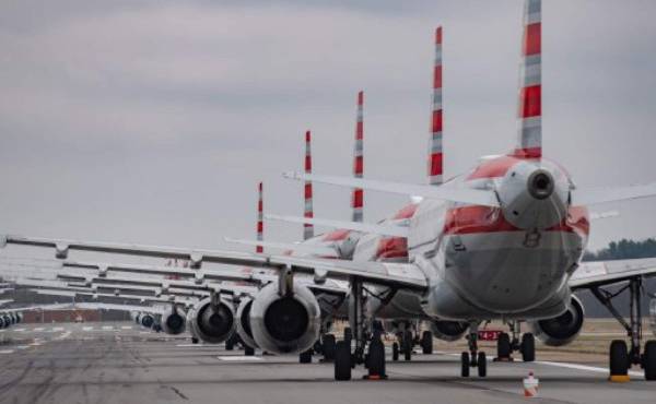 PITTSBURGH, PA - MARCH 27: Jets are parked on runway 28 at the Pittsburgh International Airport on March 27, 2020 in Pittsburgh, Pennsylvania. Due to decreased flights as a result of the coronavirus (COVID-19) pandemic, close to 70 American Airlines planes are being stacked and parked at the airport. Jeff Swensen/Getty Images/AFP