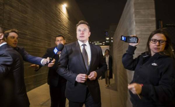LOS ANGELES, CA - DECEMBER 03: Elon Musk, chief executive officer of Tesla Inc. leaves the US District Court, Central District of California through a back door in Los Angeles, U.S. on December 3, 2019 in Los Angeles, California. The defamation lawsuit against Tesla CEO Elon Musk began in Los Angeles over calling British cave explorer Vernon Unsworth ''Pedo Guy' and rapist. Unsworth was one of the first cave divers to reach the trapped boys in the flooded Tham Luong caves in Thailand. Apu Gomes/Getty Images/AFP