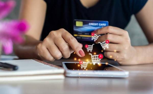 closeup woman hand holding smart phone and credit card to order, shopping online