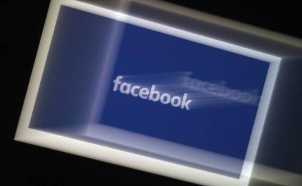 (FILES) In this file photo illustration taken on February 17, 2019, the US social media Facebook logo displayed on a tablet in Paris. - Facebook says it will ban political advertising the week before the US election, one of its most sweeping moves against disinformation yet as CEO Mark Zuckerberg warned of a 'risk of civil unrest' after the vote. The social media giant also vowed to fact check any premature claims of victory, stating that if a candidate tries to declare himself the winner before final votes are tallied 'we'll add a label to their posts directing people to the official results.' (Photo by Lionel BONAVENTURE / AFP)
