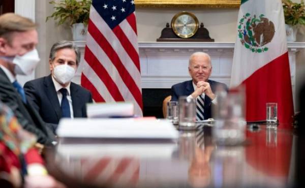 President Joe Biden, accompanied by White House national security adviser Jake Sullivan, left, and Secretary of State Antony Blinken, second from left, attends a virtual meeting with Mexican President Andres Manuel Lopez Obrador, in the Roosevelt Room of the White House, Monday, March 1, 2021, in Washington. (AP Photo/Andrew Harnik)